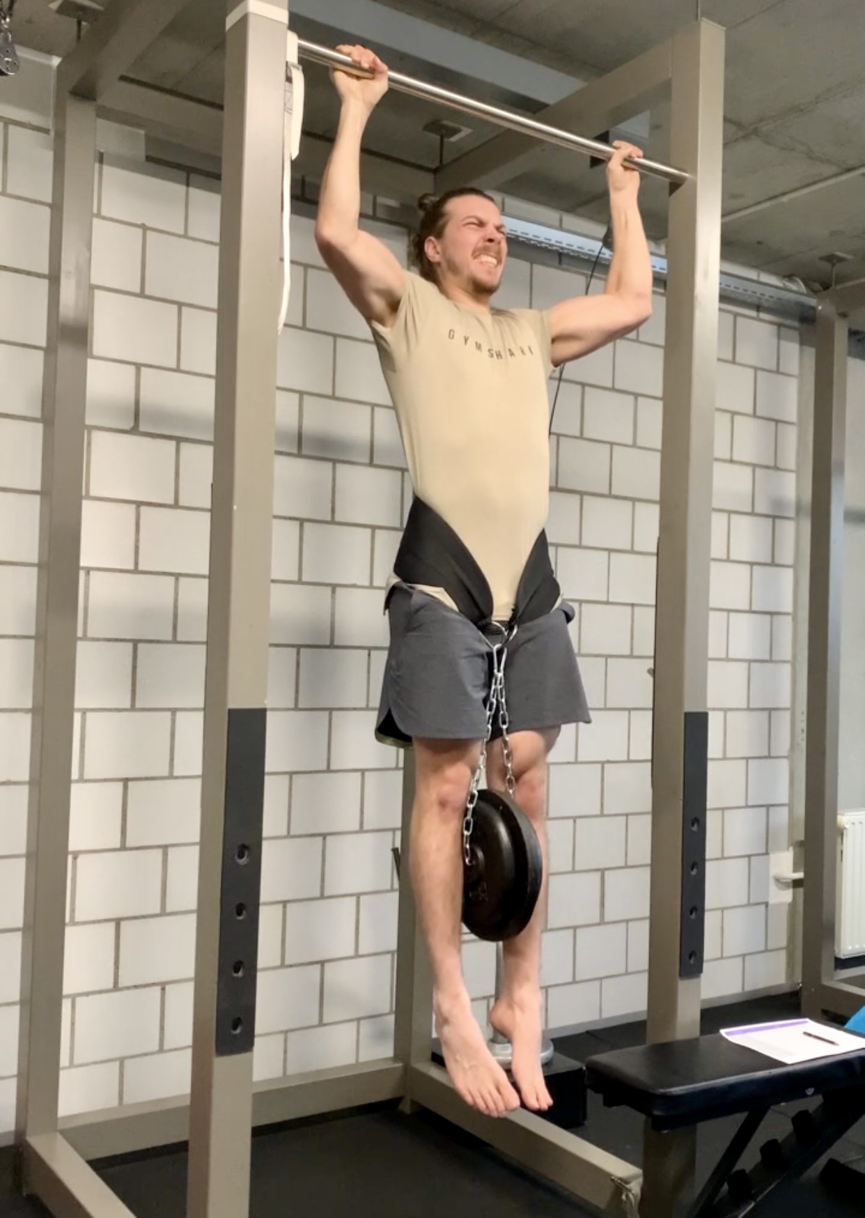 lars doing a loaded pull up
